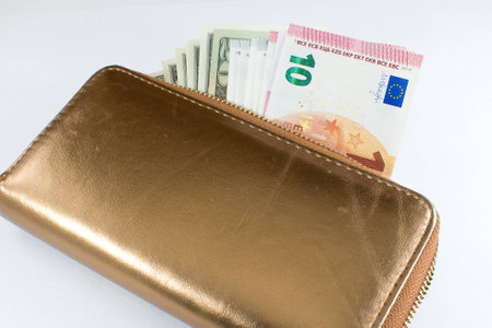 Leather men's open wallet with dollar and euro banknotes insideの写真素材