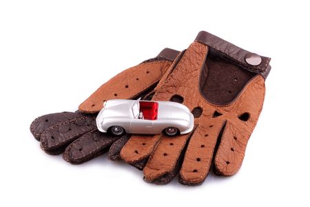 Sports a car retro and leather brown gloves  isolated on the white backgroundの写真素材