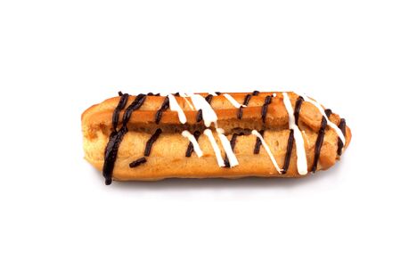 Eclair with a chocolate cream stuffing  isolated on the white background 