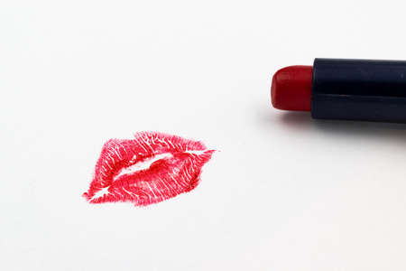 Red lipstick mark and lipstick isolated on a white backgroundの写真素材