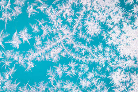 Cold winter morning ice flowers on glass, background with copy spaceの写真素材