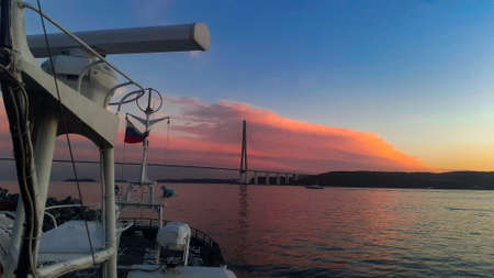 Sunset over the Adriatic Sea in Montenegro. A view from the deck of a sailboat.の写真素材