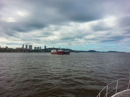 Cargo ship sailing in the sea. Transportation of goods by sea.