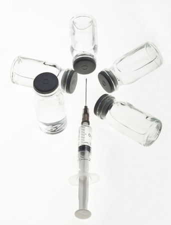 Glass Medicine Vials with liquid and Syringeの写真素材