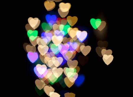 Heart Colorful Bokeh on a Black Backgroundの写真素材