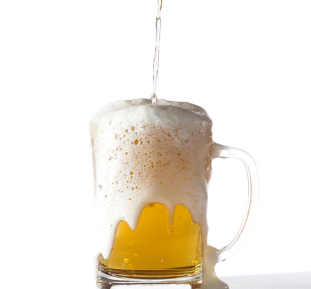 Glass of light beer isolated on white background.の写真素材
