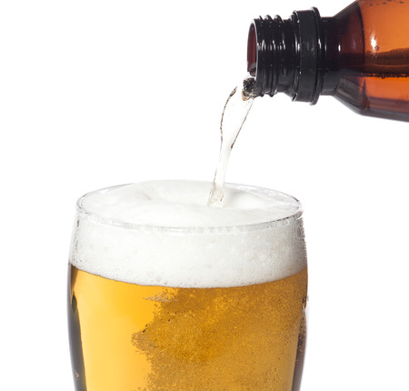 Glass of light beer isolated on white background.の写真素材