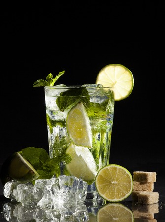 Glass of mojito cocktail on a black background.の写真素材