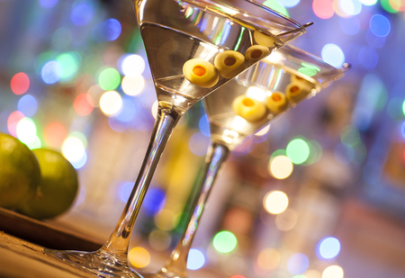Two glasses of martini coctail in a barの写真素材