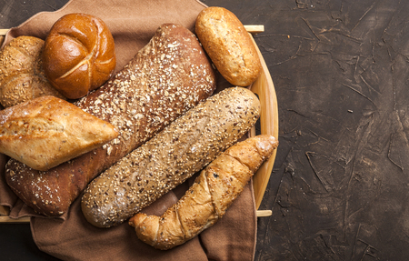 Assortment of baked goods on dark table with free copy space for text. Top view, from above, flat lay.の写真素材