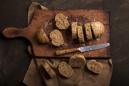 Sliced traditional bread on dark table with copy space. Top view.の写真素材