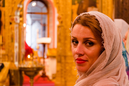 Beautiful girl believer in the churchの写真素材