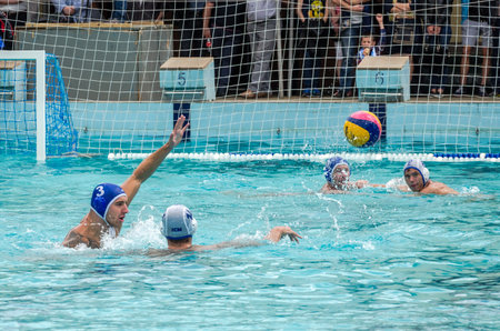 Lviv, Ukraine - July 2015: Ukrainian Cup water polo. Athlete team's water polo ball in a swimming...