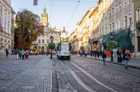 Lviv, Ukraine - September 2015: Central Square near City Hall on Lviv Market Square at which the tram rides and walking people and touristsのeditorial素材