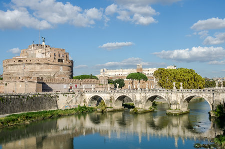 Historic Landmark architecture Eliyev build a bridge to the Castel Sant'Angelo in Rome, on the banks of the Tiber River near the arched bridge across the river on a bright sunny dayのeditorial素材