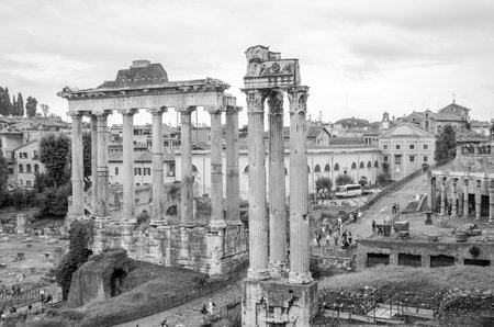 Roma, Italy - October 2015: Tourists walk and take pictures in the photo on the tour of the ancient ruins of the ancient imperial capital of the Roman Forum in Rome, Italyのeditorial素材