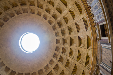 Giant dome of the Pantheon with a square pattern with a hole in the middle and the sunlight that makes its way into the church in the capital of Italy, Romeのeditorial素材