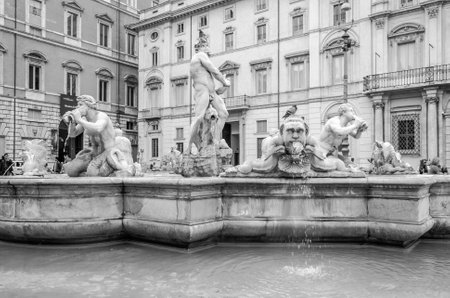 Roma, Italy - October 2015: Tourists walking on the tour of the monument near the fountain Moro with marble sculptures in the Piazza Navona in Rome, capital of Italyのeditorial素材