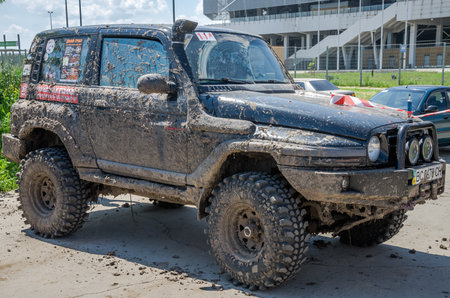 LVIV, UKRAINE - MAY 2016: Sport rally car UAZ in the mud after the raceのeditorial素材