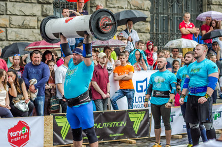 LVIV, UKRAINE - JUNE 2016: Strong athlete bodybuilder strongman inflated with a beautiful body to...