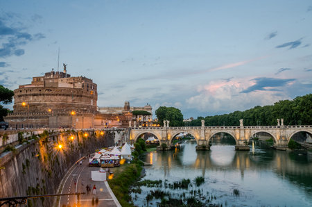 Bridge over the Tiber River near the Castle of the Angel - Vatican prison at sunset on an evening summer day in Rome, Italyのeditorial素材