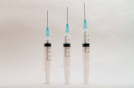 A medical syringe recruits a vaccine from an ampouleの写真素材