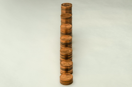 Growing mountain of coins in denomination of two euro cents isolated on white background