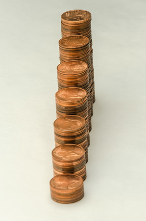 Growing mountain of coins in denomination of two euro cents isolated on white backgroundの写真素材