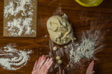 Mom and daughter are making flour out of flour to cook dumplingsの写真素材