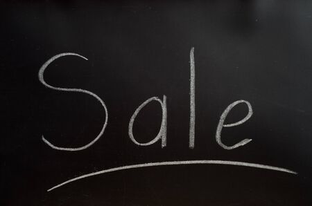 The inscription is white chalk on a blackboard: saleの写真素材