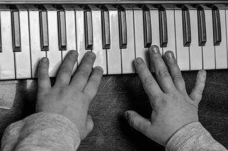 Little child learn to play the pianoの写真素材