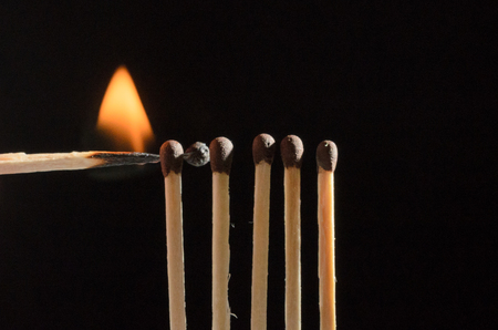 Burning matches isolated on black backgroundの写真素材