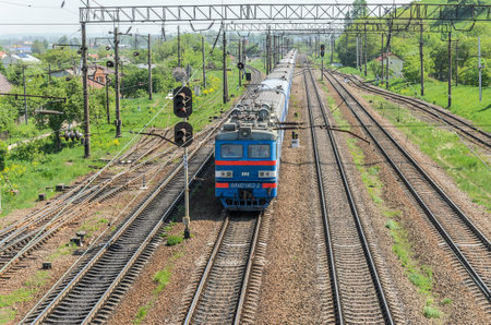 LVIV, UKRAINE - MAY 2018: A freight train rides the railway stationのeditorial素材