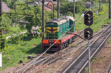 LVIV, UKRAINE - MAY 2018: A freight train rides the railway stationのeditorial素材