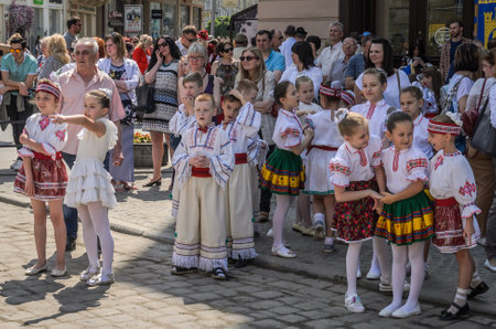LVIV, UKRAINE - MAY 2018: Children in national costumes at a parade in the city center