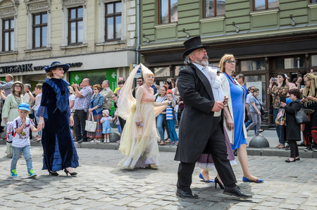 LVIV, UKRAINE - MAY 2018: Artists in carnival costumes are walking in the center of the city on paradeのeditorial素材