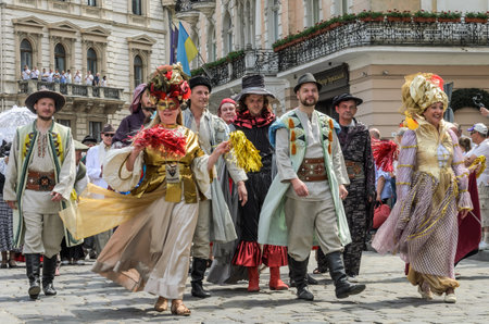 LVIV, UKRAINE - MAY 2018: Artists in carnival costumes are walking in the center of the city on paradeのeditorial素材