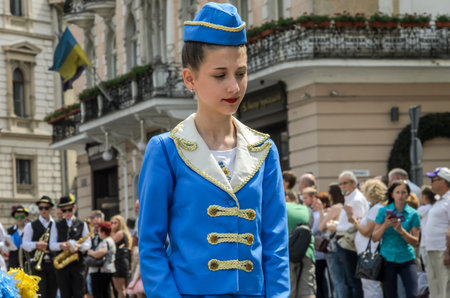 LVIV, UKRAINE - MAY 2018: Girls in blue carnival costumes at the parade in the city center