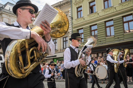 LVIV, UKRAINE - MAY 2018: The musical orchestra performs at an exhibition concert during a parade in...