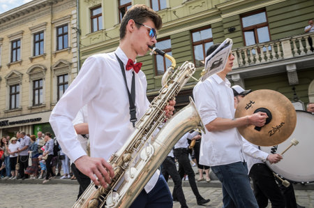 LVIV, UKRAINE - MAY 2018: The musical orchestra performs at an exhibition concert during a parade in...