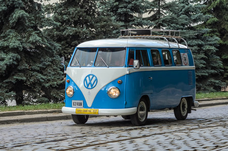 LVIV, UKRAINE - JUNE 2018: Old vintage retro classic blue and white Volkswagen camper bus car rides through the streets of the cityのeditorial素材