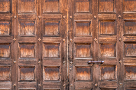 Texture of old wooden doors with square patternの写真素材