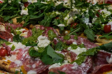 Italian pizza with meat and vegetablesの写真素材