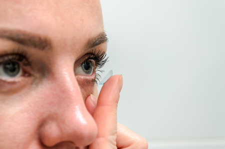 Woman wearing contact lenses for vision correctionの写真素材