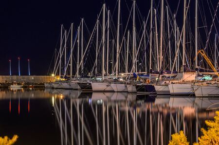 Night port with luxury sailing yachtsの写真素材