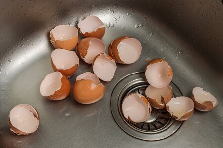 Broken egg shell in the washbasin
