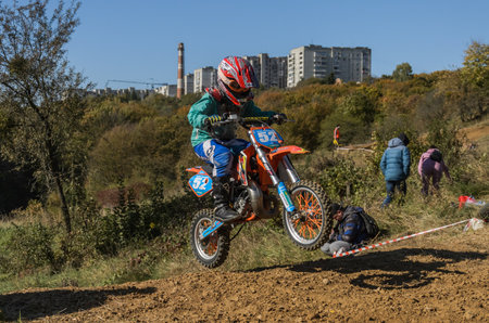 LVIV, UKRAINE - OCTOBER 2021: Athletes motorcycle racers compete in motocross competition on the race trackのeditorial素材