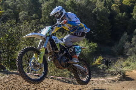 LVIV, UKRAINE - OCTOBER 2021: Athletes motorcycle racers compete in motocross competition on the race trackのeditorial素材