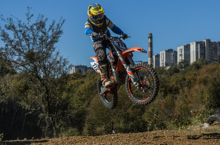 LVIV, UKRAINE - OCTOBER 2021: Athletes motorcycle racers compete in motocross competition on the race trackのeditorial素材