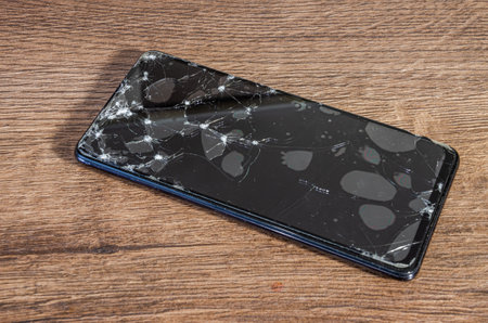 Cracked, broken screen on smartphoneの写真素材